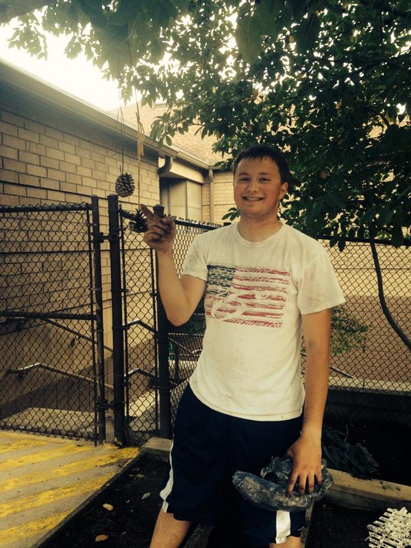JohnGlennCLC's tweet photo. .@MacDaddyDorkat made a lovely pinecone ornament after spreading mulch at the childhood league center #CLCserves http://t.co/5W0V0Zkeps