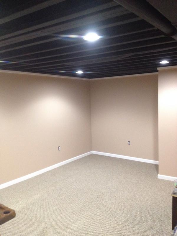 Basement with exposed ceiling project is complete! #blackceiling #basementrefinish Exposed ceiling painted black!