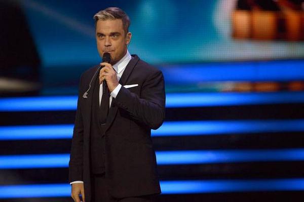 Robbie Williams 'sick and violated' over paparazzi stalking family
ind.pn/1nBMagC
