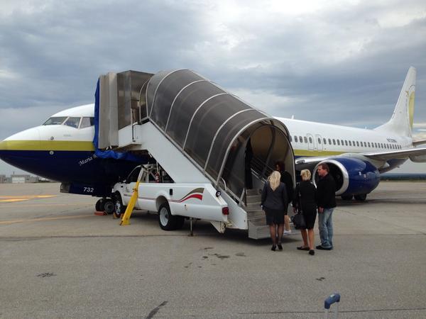 cruiseapalooza's tweet image. Boarding our @CharterMiamiAir 737 flight from Gander to MIami. We love the personable crew and great service.