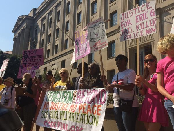 ceboardman's tweet image. Protestors call for Attorney General Eric Holder to end police militarization @medillonthehill @KANicastro