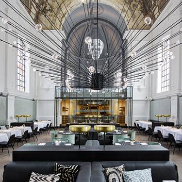 #TimelessQuality. Dutch designer Piet Boon turns a military hospital chapel in Antwerp into a striking restaurant.