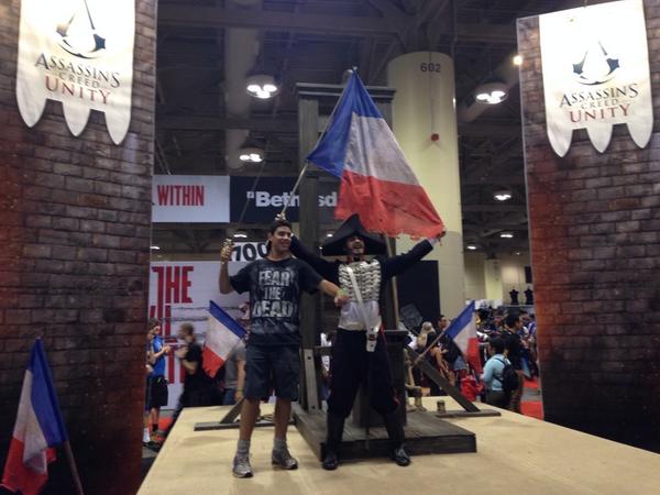 UbisoftCanada's tweet photo. Make history with our #UnityExperience photo booth complete w/ life sized guillotine and French guard @assassinscreed http://t.co/vkBsk7LLuI