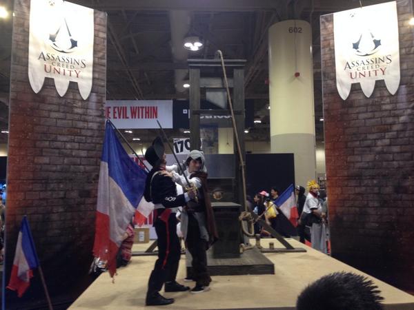 UbisoftCanada's tweet photo. Make history with our #UnityExperience photo booth complete w/ life sized guillotine and French guard @assassinscreed http://t.co/vkBsk7LLuI