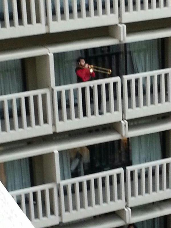 live2netflix's tweet photo. There's a guy dressed up as Riker standing on a balcony playing a trombone. #DragonCon2014 http://t.co/MiJTW4r3l7