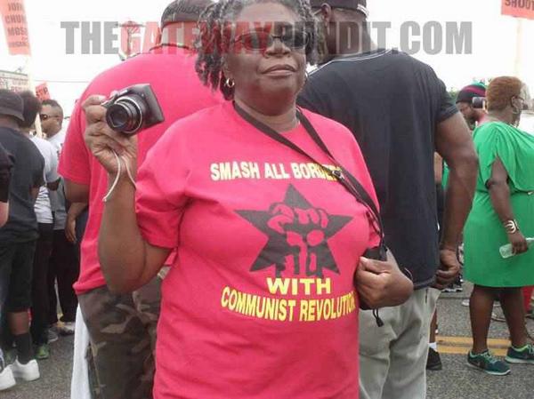 Communists, defaced American flag at rally in ferguson