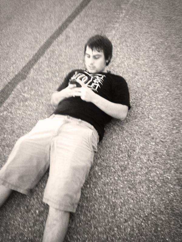 thisbitchAng's tweet photo. My nephews way of sleeping LOLOL!! He's such a dork! Just going and laying down in the middle of the street http://t.co/9laXEQvPu7