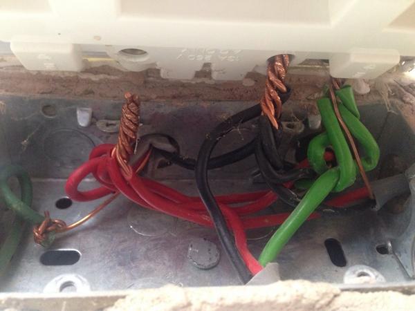 Someone doing a bit of #DIY tried to cram 5 wires together into the back of a double socket! It didn't work...