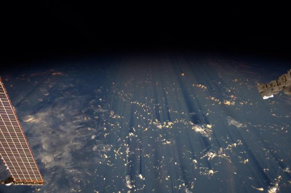 Clouds cast thousand-mile shadows into the black of #space. A favorite view of ours. @astro_alex