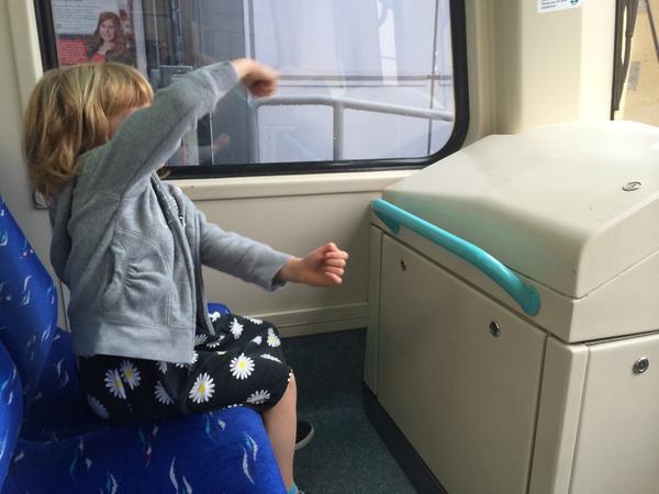 Alice driving a train