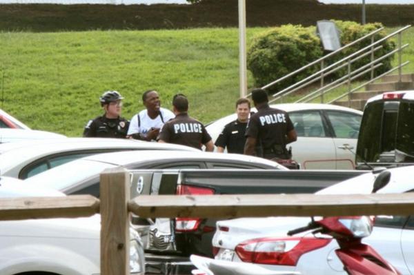 JuddLegum's tweet photo. Police arrest young black politician for distributing voting rights leaflets http://t.co/ff9j3kqkPw http://t.co/99mWPSsGsd