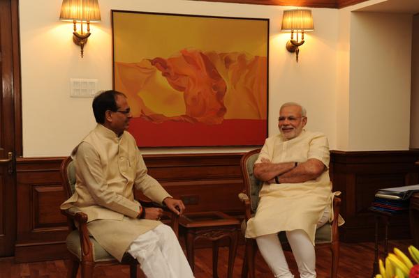 PMOIndia's tweet photo. MP CM @ChouhanShivraj met the PM http://t.co/5cLjLjjVkh