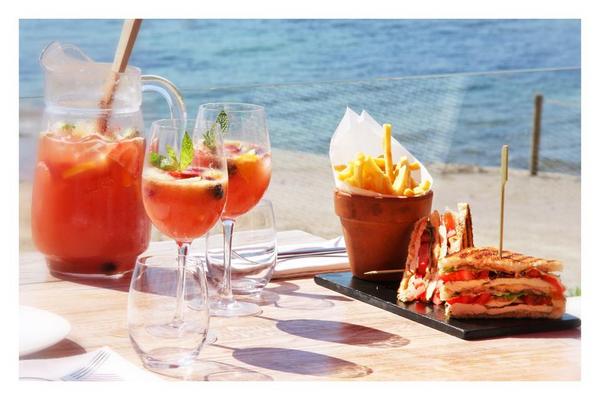 Enjoy our famous "Sa Punta Club Sandwich" with a glass of sparkling vine sangria. #sapunta #summer #ibiza