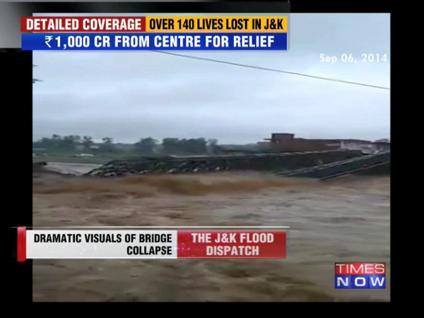 TimesNow's tweet photo. River Tawi above danger level due to flooding, washes away bridges http://t.co/lvfRxiWYpe - #KashmirFloods http://t.co/3BhinOlBFd
