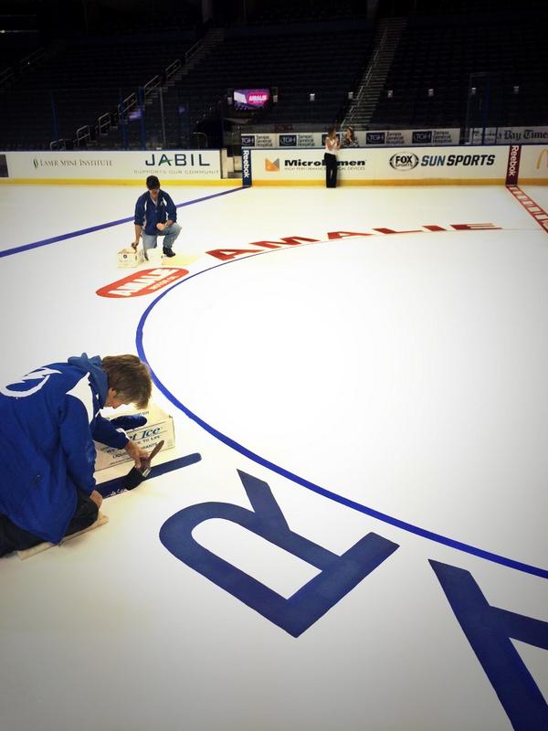 The team has been carefully painting <a href="/AmalieOil/">AmalieOil</a> at center ice. How exciting!