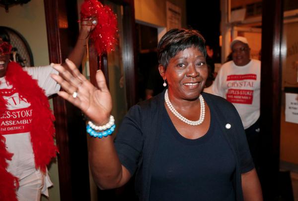 RobertKirkhamBN's tweet photo. Crystal Peoples-Stokes waves to supporters as she makes her way into her party on Main St.  #Primary2014 http://t.co/BMI71Osagm