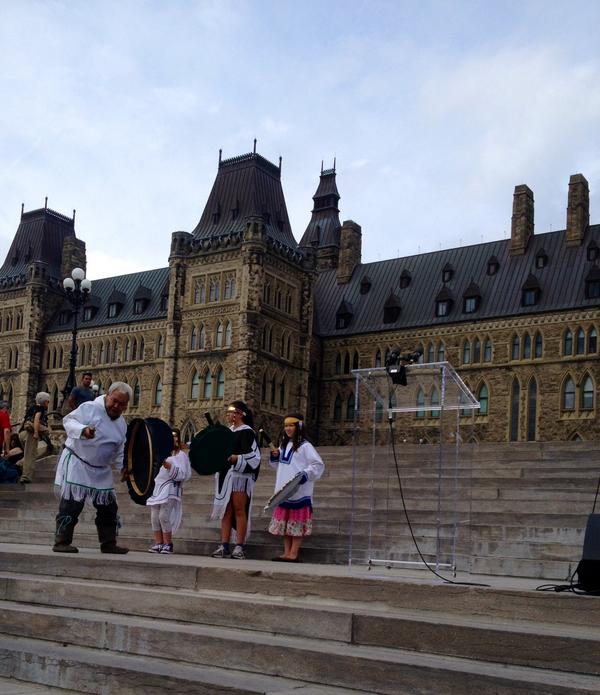 Inuit elder David Serkoak and his grandchildren drum dancing on Parliament Hill. #WSPD14