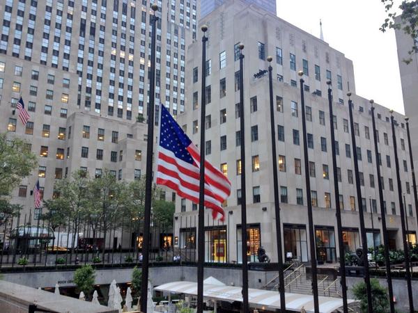 alexontheplaza's tweet photo. A single American flag flies at half-staff above Rockefeller Center to remind us 'Never Forget' http://t.co/nTsXgTBjWB