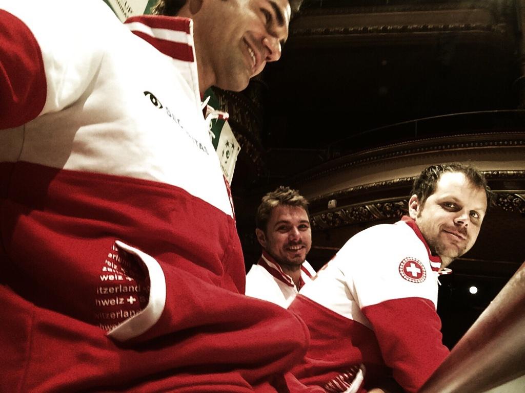 Roger Federer takes a selfie with Wawrinka and Luthi during the press conference