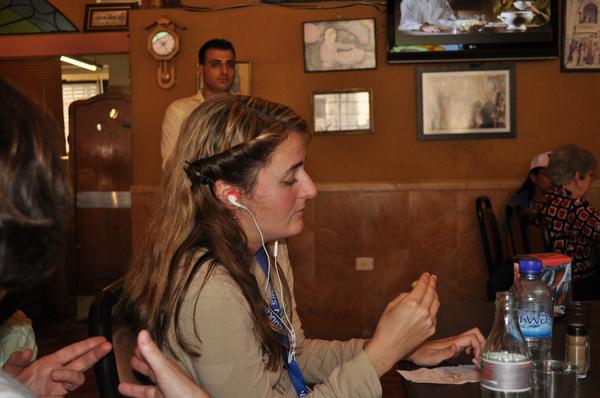 AutismJournal's tweet photo. Britt eating in a restaurant in the Israel #TravelingWithAutism http://t.co/Be085fOqus