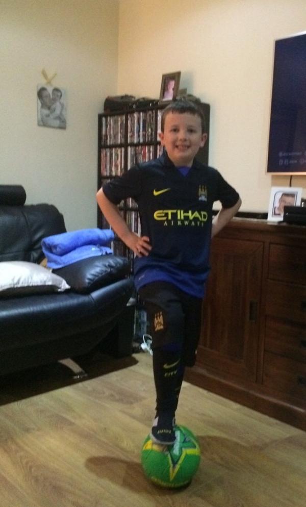 An early present for Connor so he can wear it to his 8th birthday party Man City FC Away Kit that he had to have.