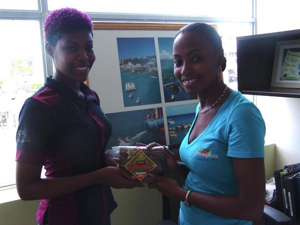 highrollersja's tweet image. Brand Manger, Moya Hendrickss presenting Peta-Gaye  of @Margaritaville with a complimentary "Party Pack"