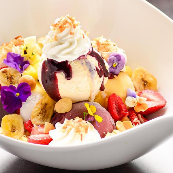 "The Carmen Miranda" with coconut, raspberry and exotic sorbet, cassis, fresh fruit, creme anglaise and banana chips