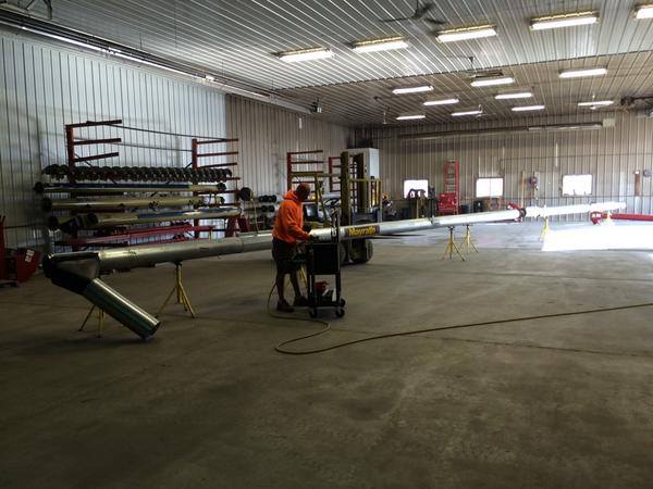 WolfGrainSys's tweet photo. Matt is assembling augers today. Selling fast in the heat of harvest. #harvest14 #mayrath #HarvestInternational http://t.co/1gHRleqgw5