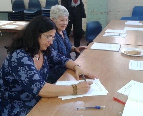 Former Moseley School of Art teacher and her daughter filling in a questionnaire...