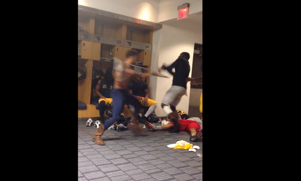 BleacherReport's tweet photo. VIDEO: West Virginia football players stage an epic WWE match in the locker room http://t.co/qmRbw4qqyW http://t.co/jz7yWDPIAv