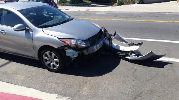 Asshole ran a red light and took off the front of my car :( #canigetaride