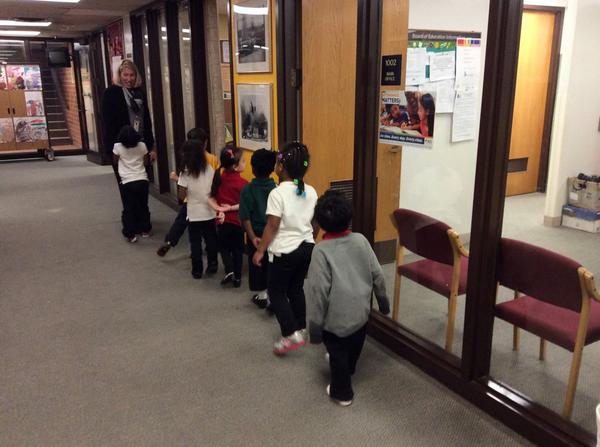 Pre-K practicing rituals and routines of being respectful, responsible, and safe in the hallway!