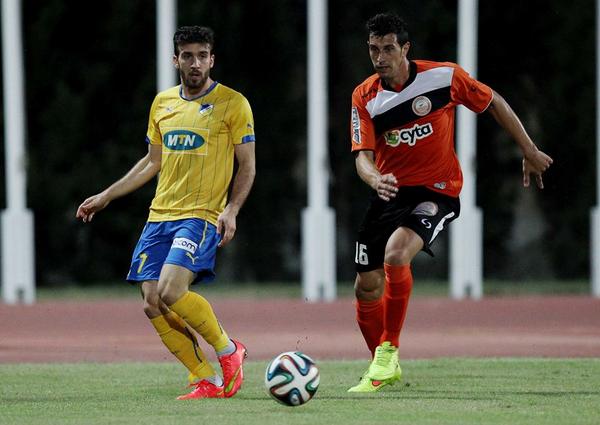Markoski defends against an APOEL player Markoski defends against an APOEL player