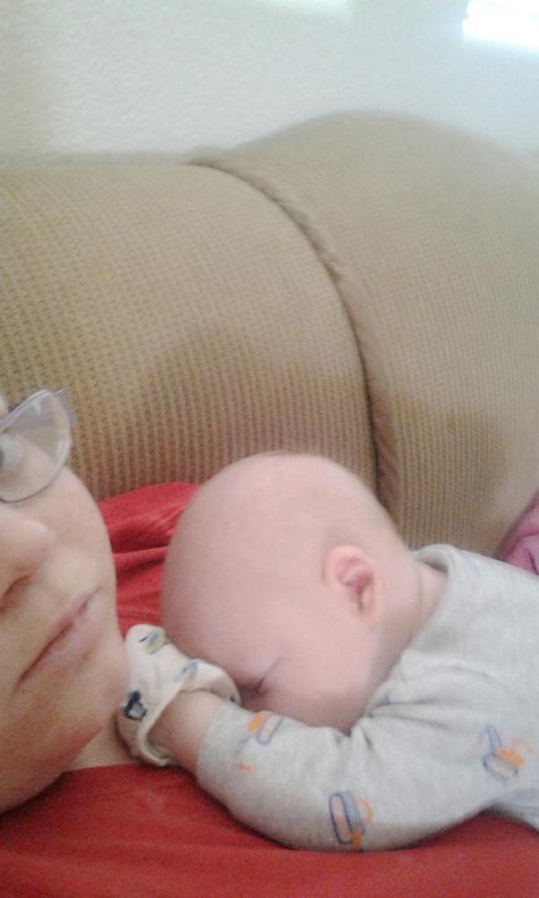 BreeBree1993's tweet photo. The only way he'd fall back asleep this morning http://t.co/d92YeFDn5b