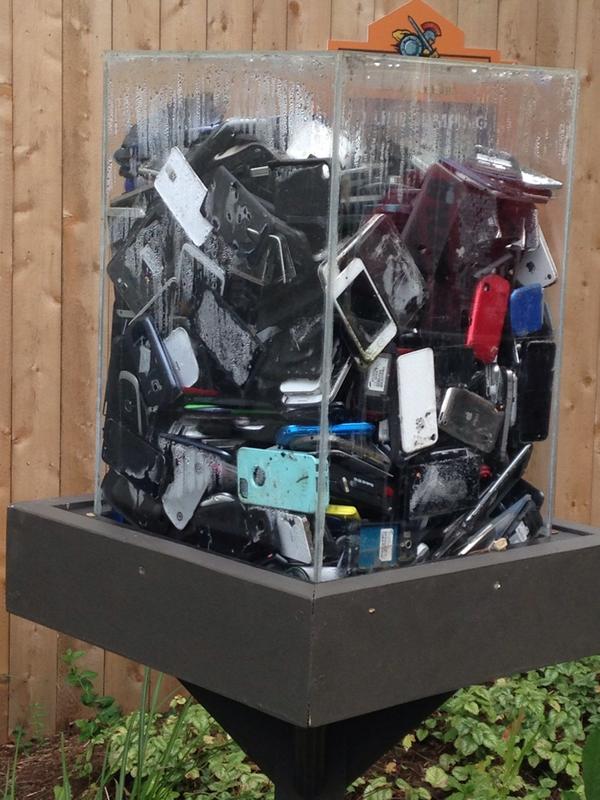 QueenPeachxo's tweet photo. "Don't be that guy." #SixFlagsGA #PhoneCemetery @SixFlags http://t.co/vQRckL6Wms