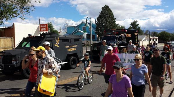 FractalMan's tweet photo. Why are cops clueless about PR? Unwelcome show of force at the Carnuel KIDS parade. #bernco #apdprotest #policestate http://t.co/M0mKssDkmW