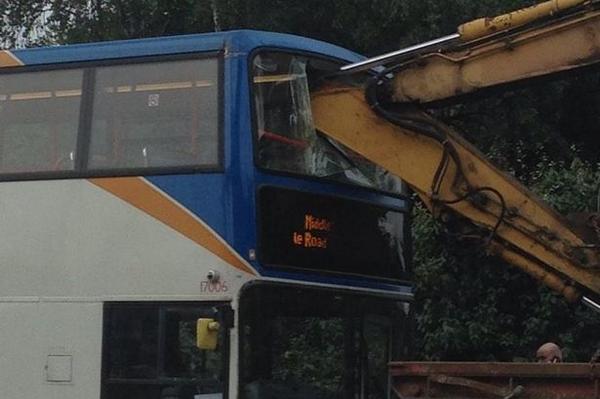 MENnewsdesk's tweet photo. Pictured: Digger arm smashes through double decker bus window in Middleton
http://t.co/XPv8k9axao http://t.co/dgeTFQo8ZQ