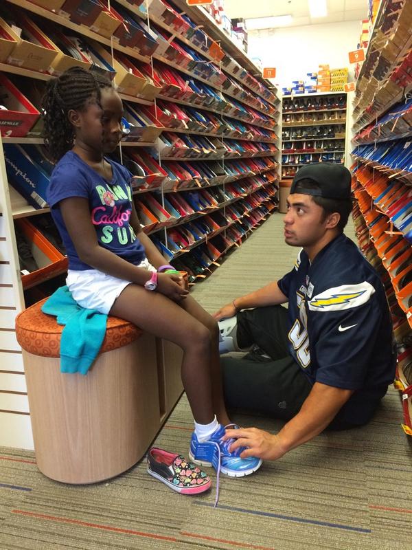 Helping students suit up for the new school year at the #BackToSchool shoe drive #Chargers