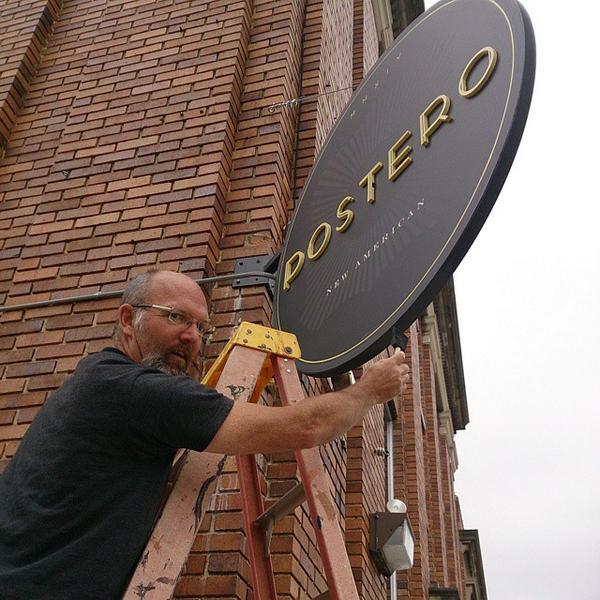 GetPMG's tweet image. The Mad Signtist (Wayne Bodley) installing the sign for Postero, a new restaurant coming to downtown #HVL