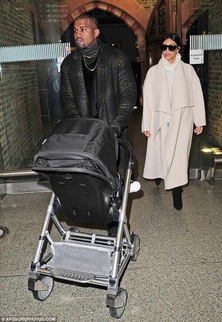 360MEDIAUK's tweet photo. These two are exaggerating. It's 19 degrees. #thewests #kimye http://t.co/y1dG8iVm30