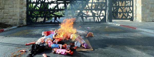 Jew hating perform blood bucket challenge at Yad Vashem