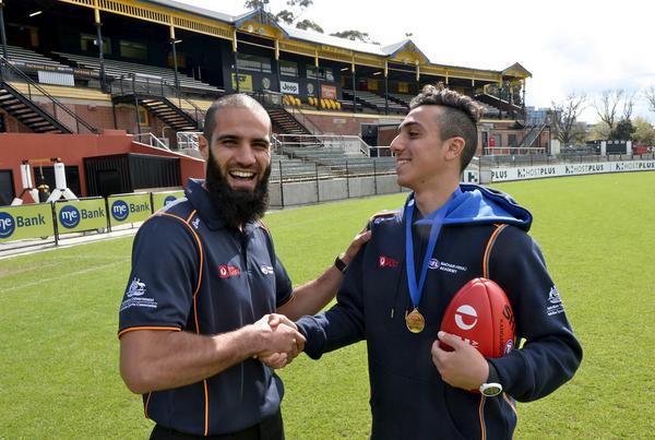 theage_photo's tweet photo. PHOTO: Winner of the inaugural Bachar Houli Academy Medal, Hisham Kerbatieh is congratulated by Bachar Houli. #AFLGF http://t.co/UQbT8uQR0s