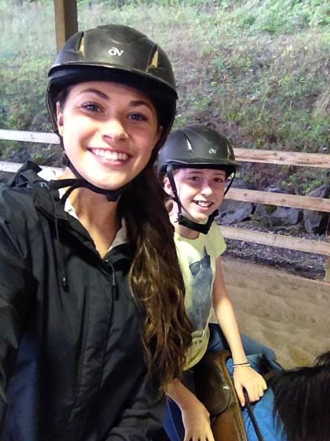 Kylievroman's tweet photo. Doing what I love. 💖🐴 #Teaching #Riding #MatchingHelmets http://t.co/zTbnyrVne0