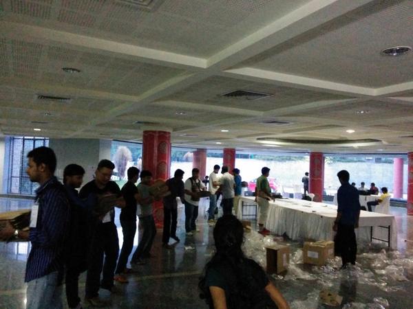 konarkmodi's tweet photo. Half an hour and packed over 1500 swags.. Chaining by the swag packing army at #pyconindia2014 !! http://t.co/ctIqbieOBa