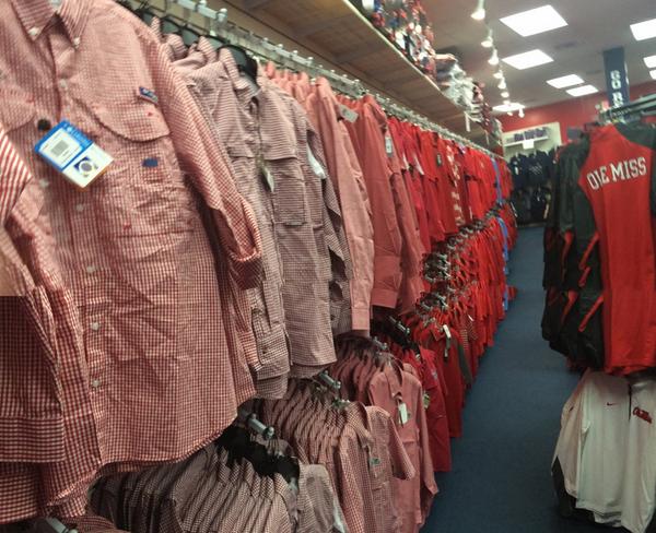 Red polo wall is stocked and ready at Rebel Rags.