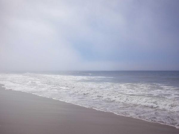 Morning fog is finally lifting at the Pacific Ocean.