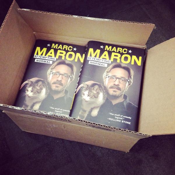 IFC's tweet photo. Oh what do we have here? It's 11 copies of @marcmaron's "Attempting Normal" Follow us &amp; retweet to enter to win. http://t.co/mw3XoVsCg4