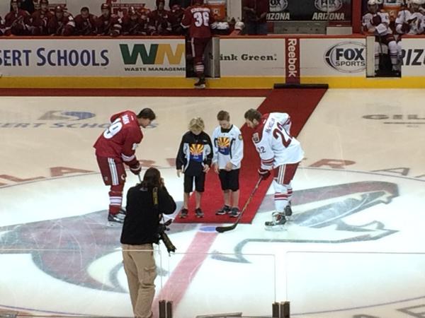 Puck drop by the children of fallen officer Cortez