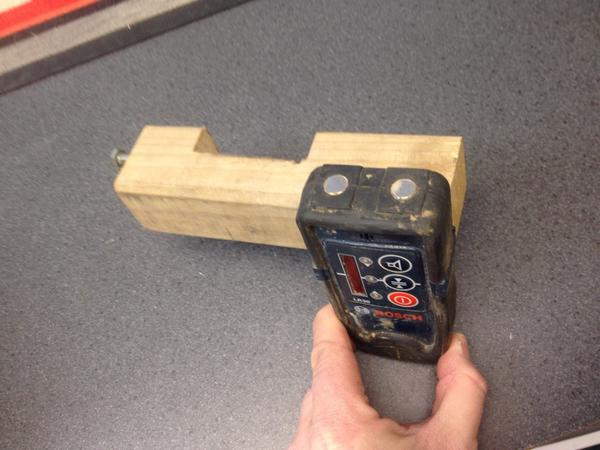 Necessity, the mother of invention.  A customer brought his laser in with this home made wooden clamp - love it!