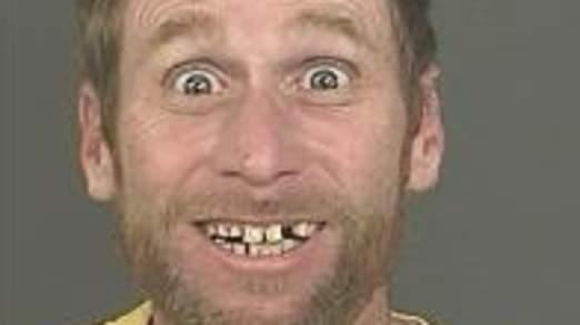 SkyNews's tweet photo. A photo of a Denver bank robbery suspect is being called "the happiest mugshot of all time" http://t.co/HlxxDgQMMt http://t.co/Dx4BqXBQwA